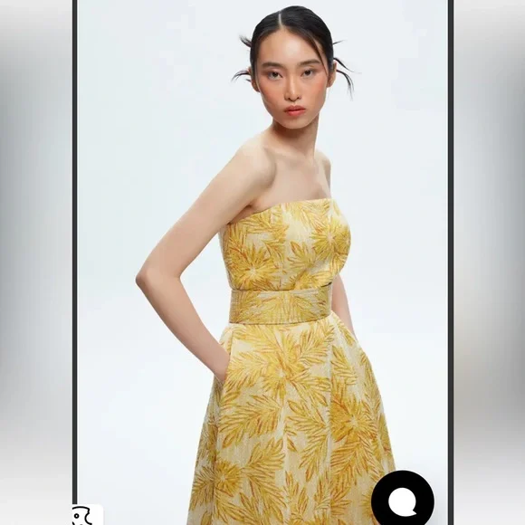 Yellow jacquard strapless gown